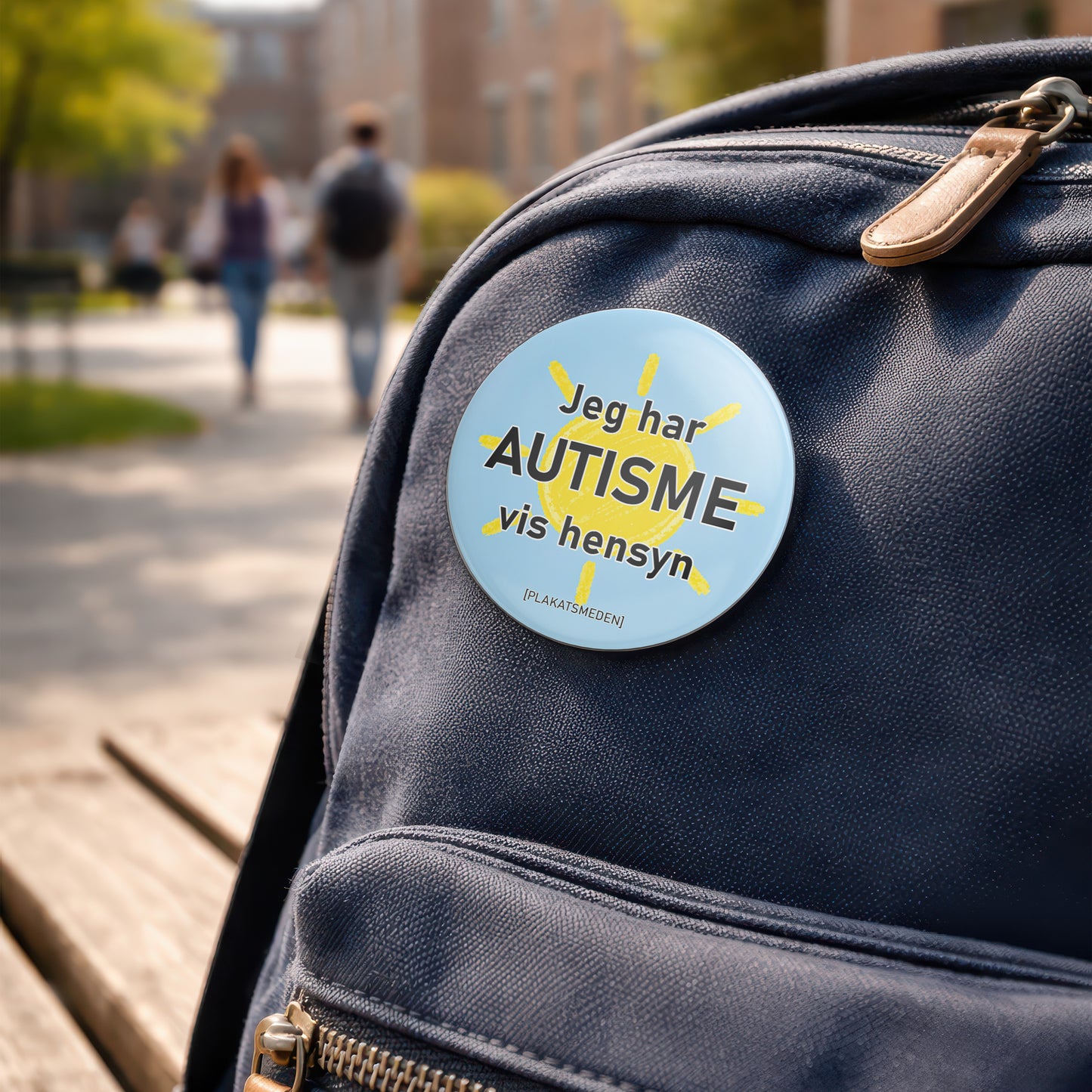 Jeg har autisme – vis hensyn" | badge med sol-motiv